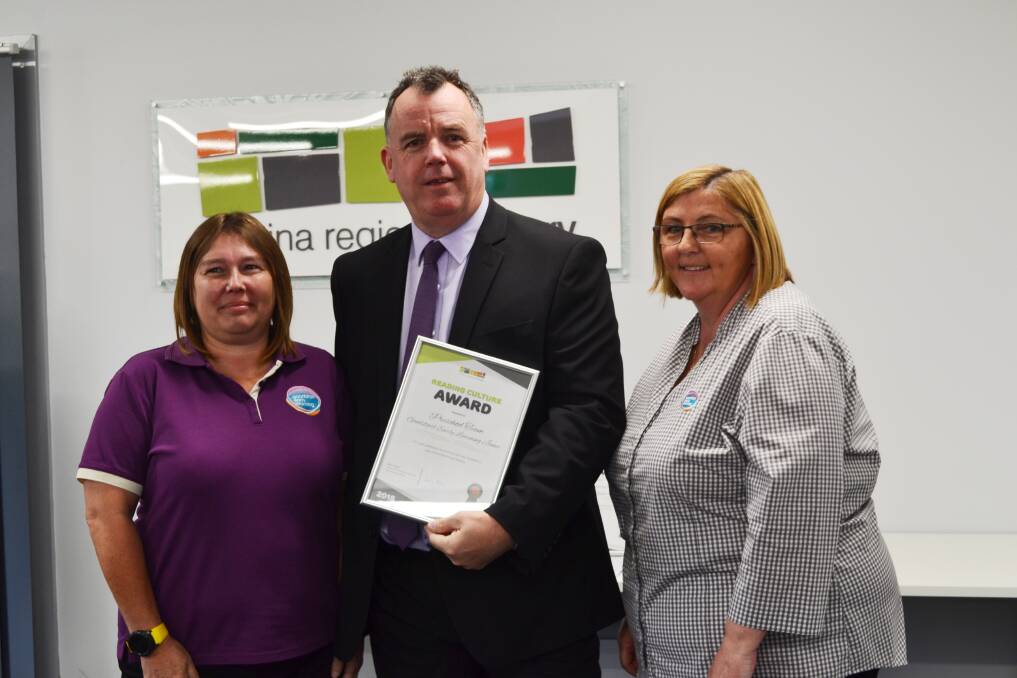 CONGRATULATIONS: Junee Goodstart centre director received the award and is pictured next to Wagga's Deputy Mayor and president of the NSW public libraries Cr Dallas Tout (middle), and childcare educator Rose Bliss (left). 