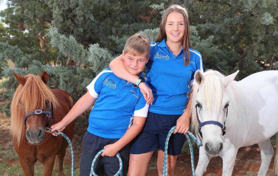 WINNERS ARE GRINNERS: Charlie Harris, 10, with Chester's Lad and his sister Brooke Harris, 14, with Pocket Watch, celebrated Miracle Mile success. Picture: Kieren L Tilly