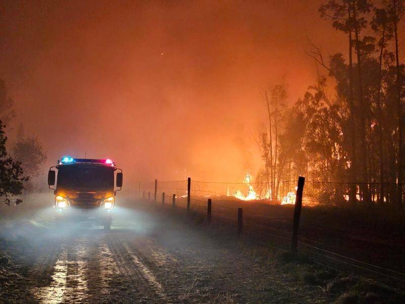 Firefighters in Queensland are tackling 60 blazes burning across the state. (HANDOUT/QUEENSLAND FIRE AND EMERGENCY SERVICES)
